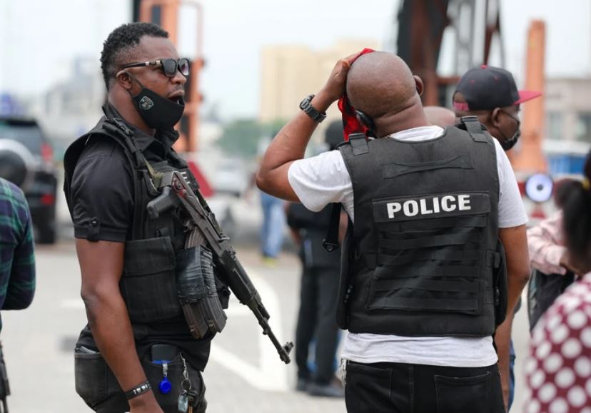 policemen on mufti with rifle